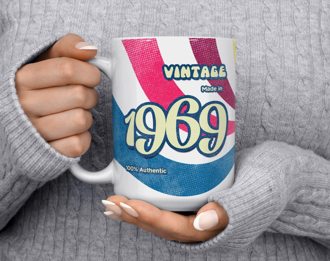 Custom Birth Year 1960's Retro Vintage Coffee Mug being held by person in grey sweater